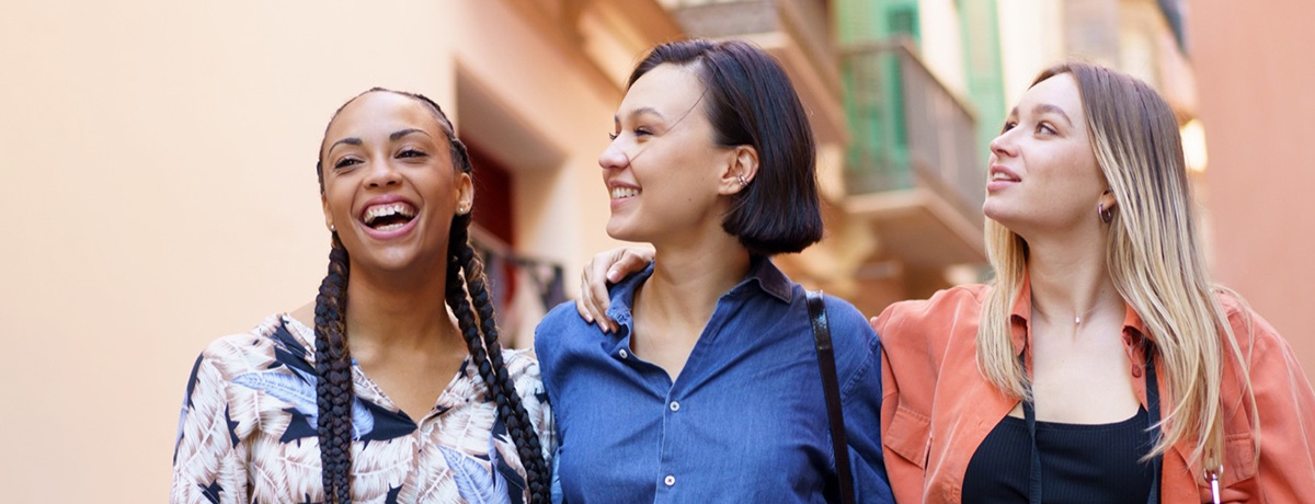 three friends walking after a shopping trip